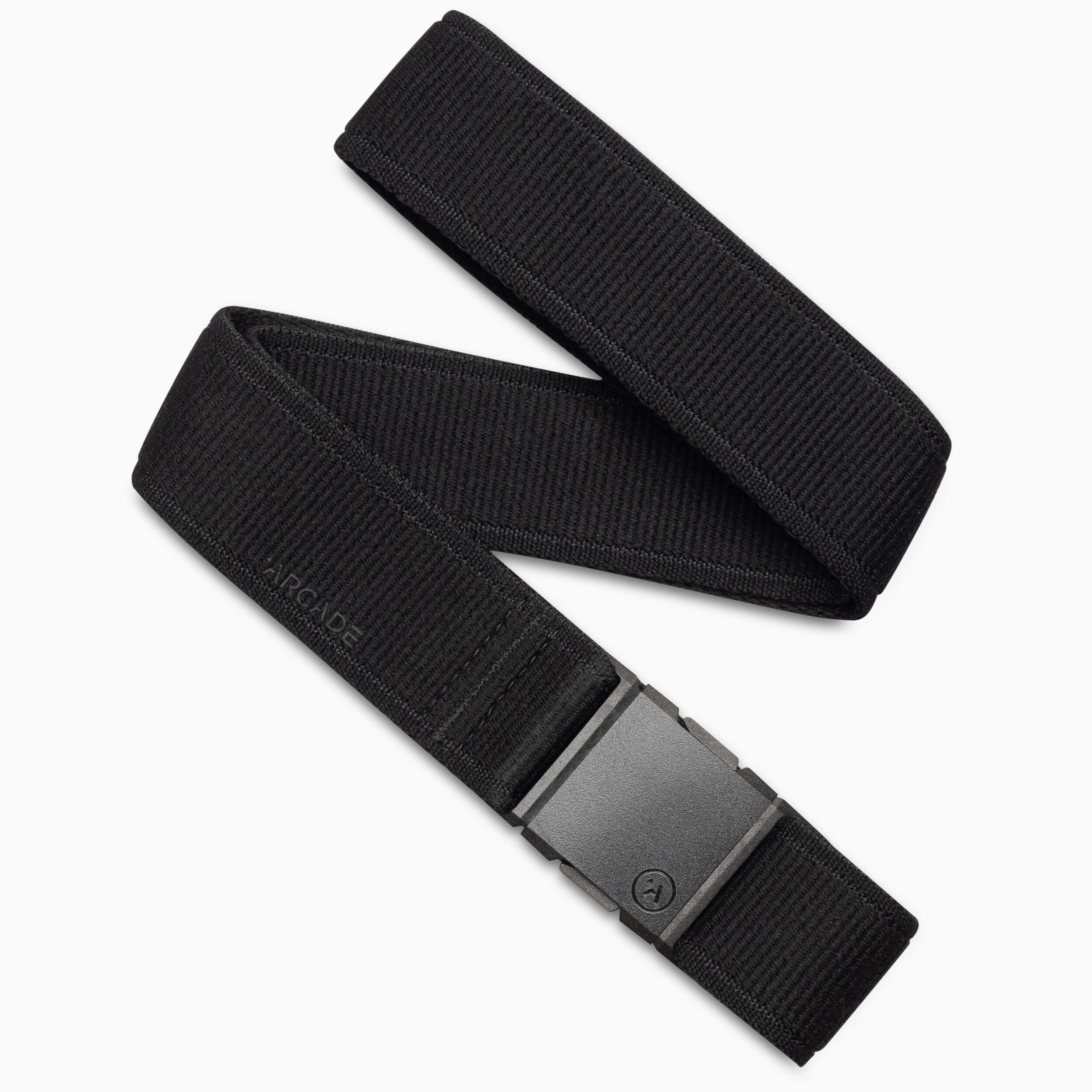 The Atlas belt by Arcade Belts features black stretch webbing for comfort, a rectangular plastic buckle, and a subtle ARCADE emboss near the buckle, emphasizing its simple, minimalist design.