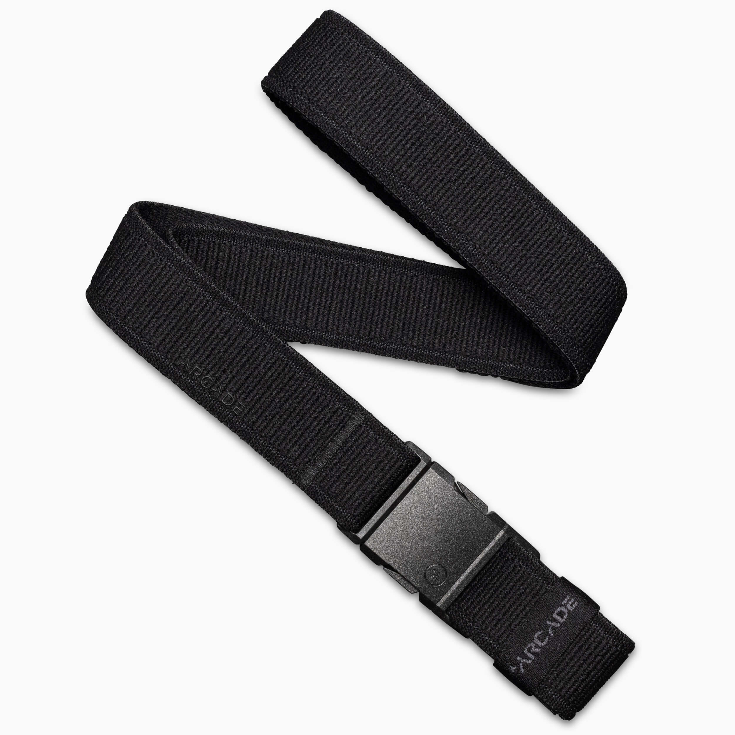 The Atlas belt from Arcade Belts features a black stretch webbing design and a rectangular plastic buckle. Displayed partially coiled on a white background, the brand name Arcade is visible near the end.