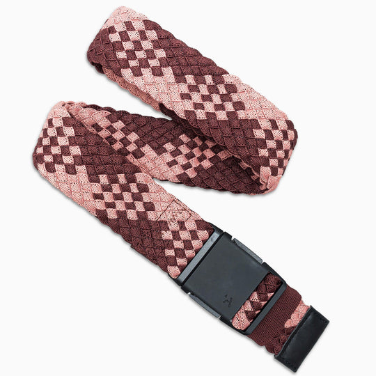 The Arcade Belts Futureweave is a stylish, low-profile maroon and pink checkered stretch belt with a sleek black rectangular buckle—ideal for comfort and travel.