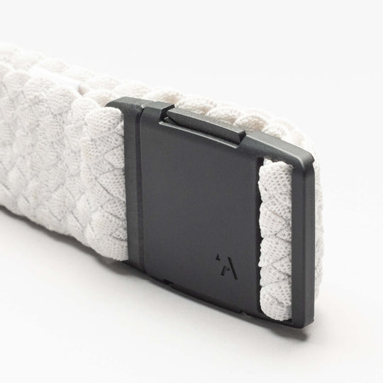 Close-up of the Arcade Belts Futureweave: a textured white, low-profile belt with a matte black plastic buckle, set against a plain white background.
