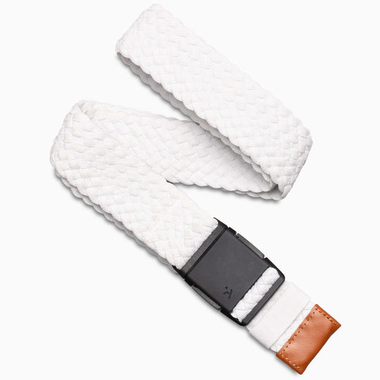 The Arcade Belts Futureweave is a white woven stretch belt with a textured pattern, black rectangular buckle, and brown leather accent, shown on a white background—ideal for travel and everyday wear.