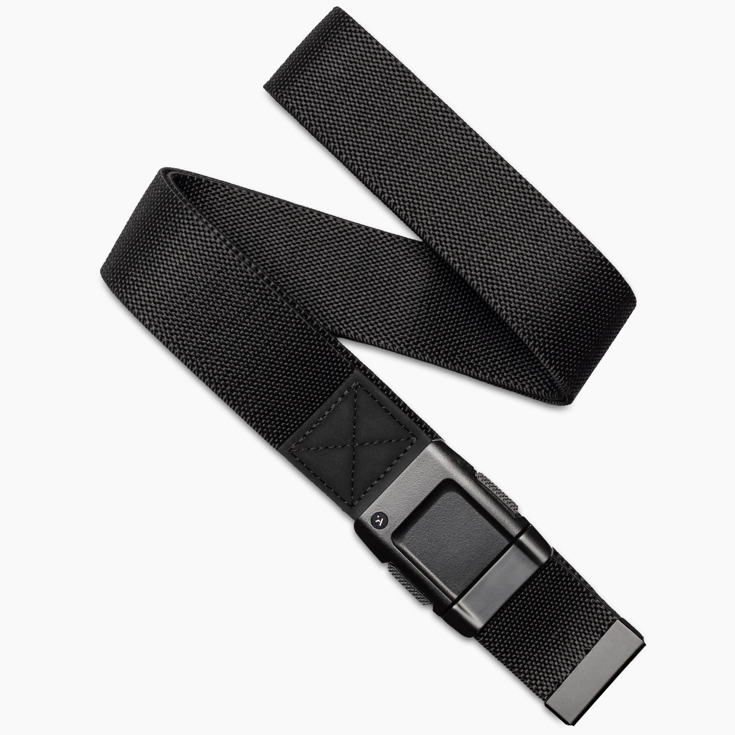 The Arcade Belts Motion is a black stretch webbing belt with a rectangular black buckle, shown diagonally on a white background. Partially coiled, it highlights both the buckle and end for a sleek, modern look.