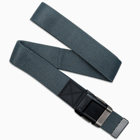 The Arcade Belts Motion is a gray stretch webbing belt with a black buckle and black leather accent, shown in a loose zigzag shape on a white background.