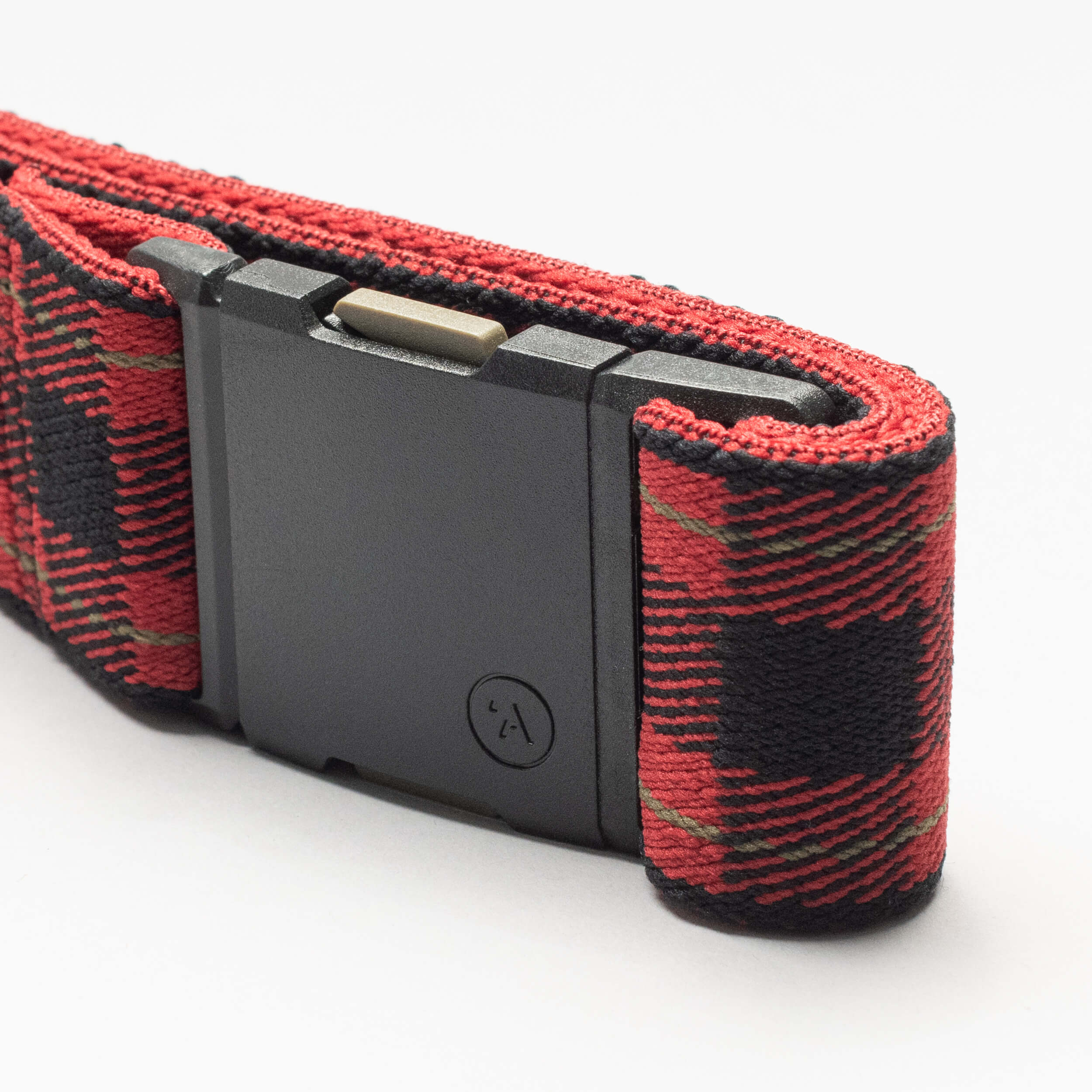 A close-up of the Arcade Belts Plaid elastic stretch belt in red and black with a rectangular black buckle, shown on a white background.