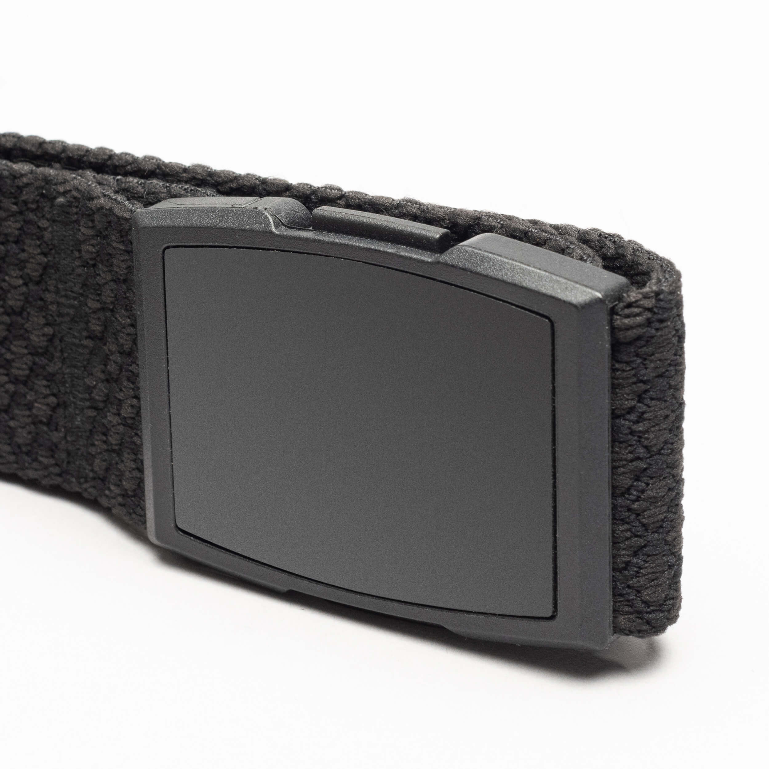 A close-up of the Arcade Belts Salient, a black elastic stretch belt with a rectangular matte black plastic buckle, shown against a white background.