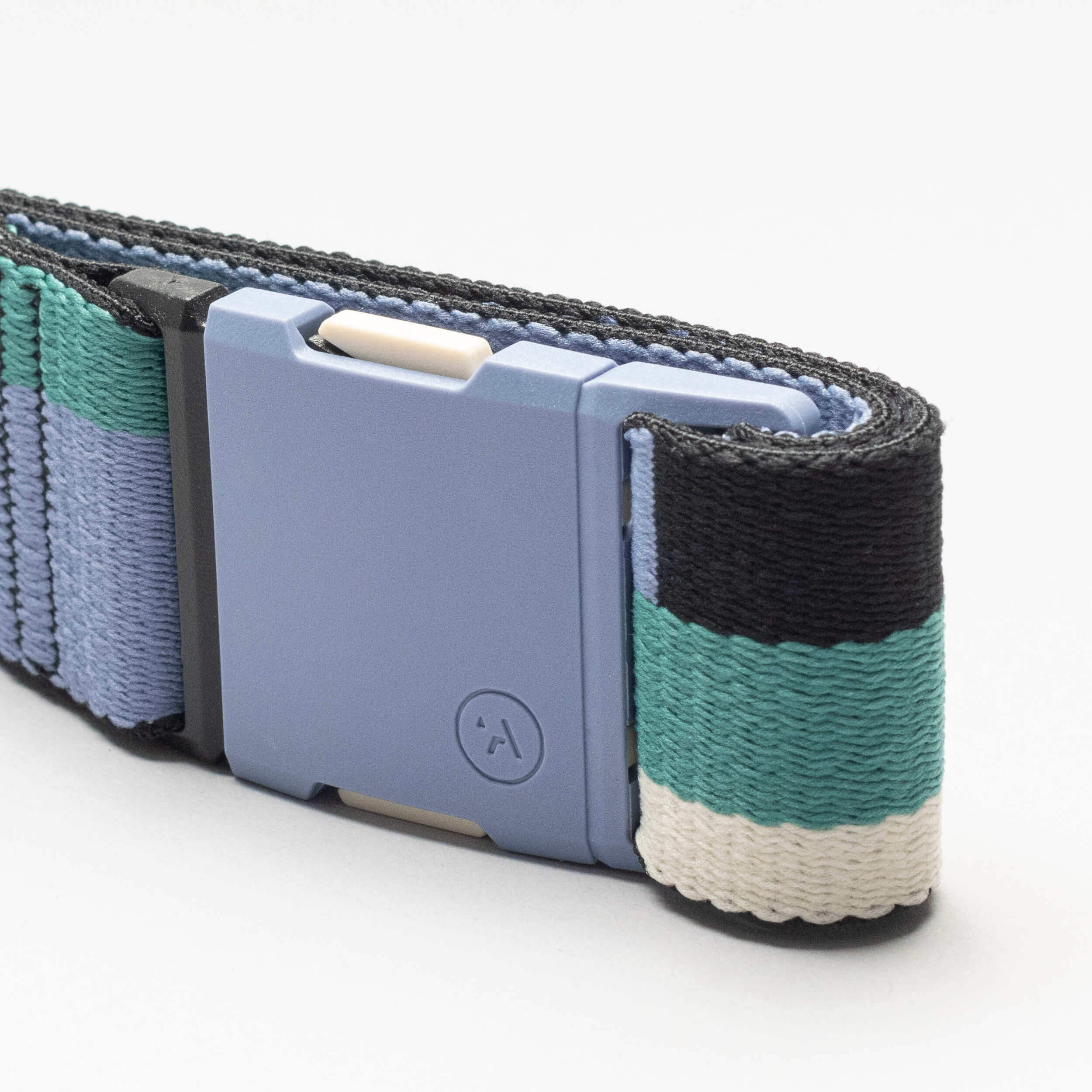 Close-up of the Sierra watch band by Arcade Belts, showcasing black, teal, white, and light blue stripes with a light blue plastic buckle against a white background.