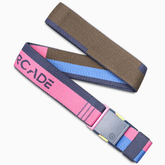 The Sierra by Arcade Belts is a stretch webbing belt with a plastic buckle, featuring a color block design in brown, pink, blue, and navy. ARCADE is woven in pink on the navy section for extra style and flexibility.