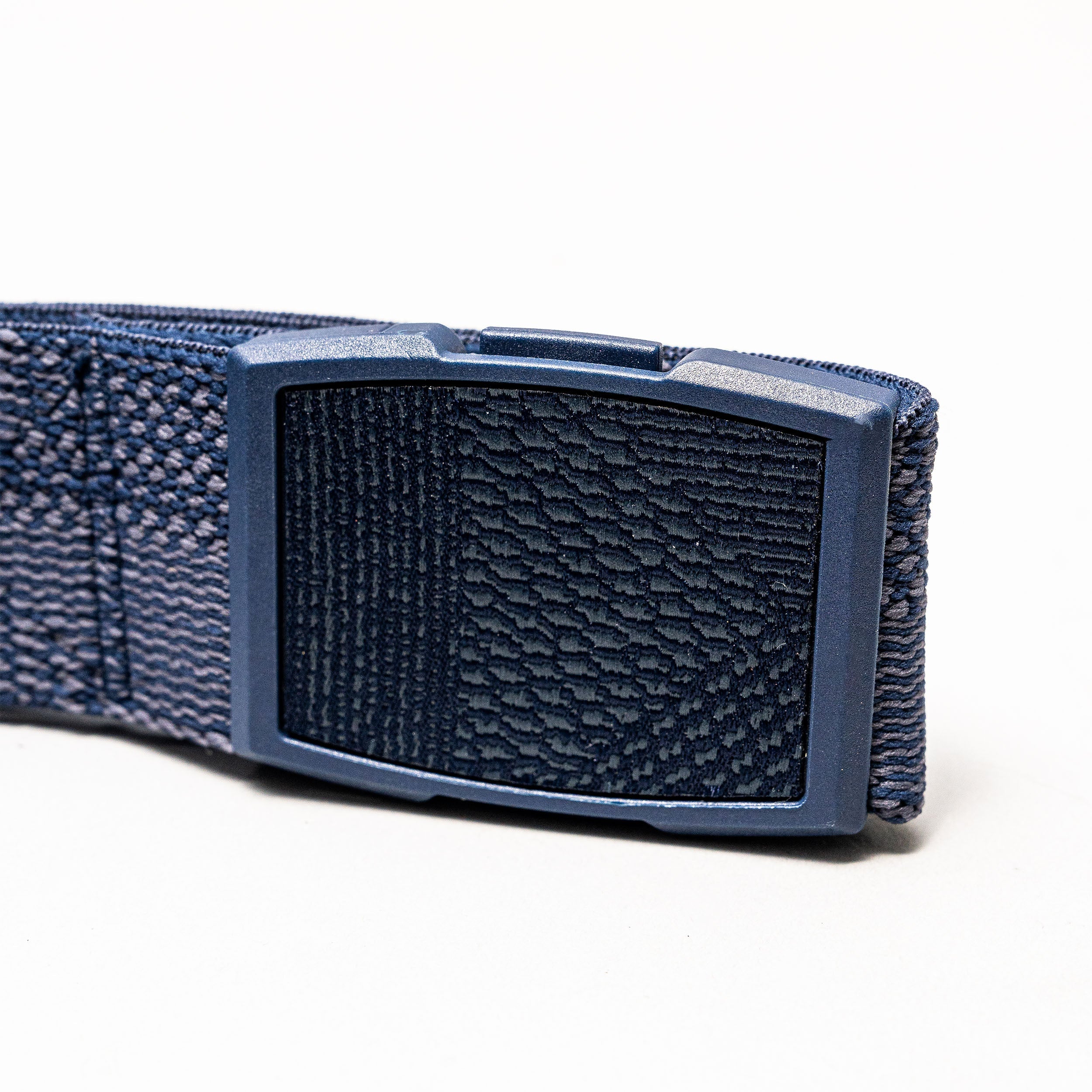 Close-up of the Arcade Belts Skyline, a blue elastic stretch belt with a rectangular textured plastic buckle, displayed on a plain white background.